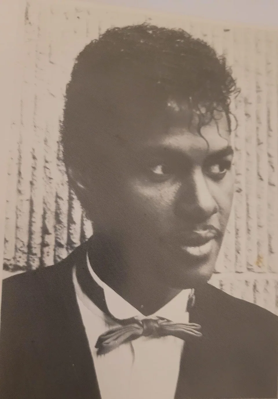 An early portrait of Keith wearing a bow tie