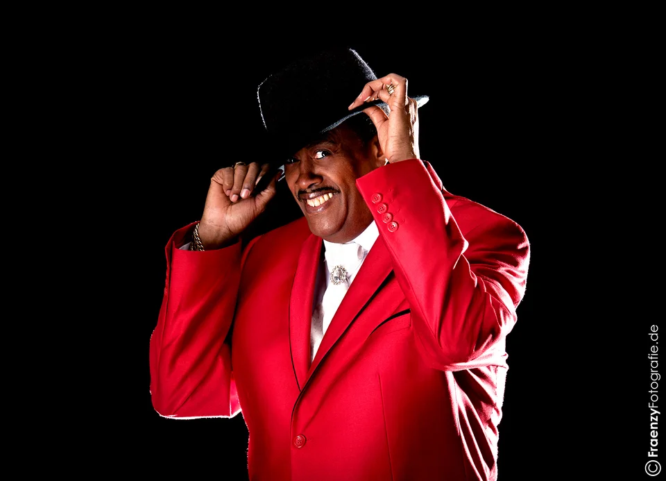 Keith in a red jacket and black hat