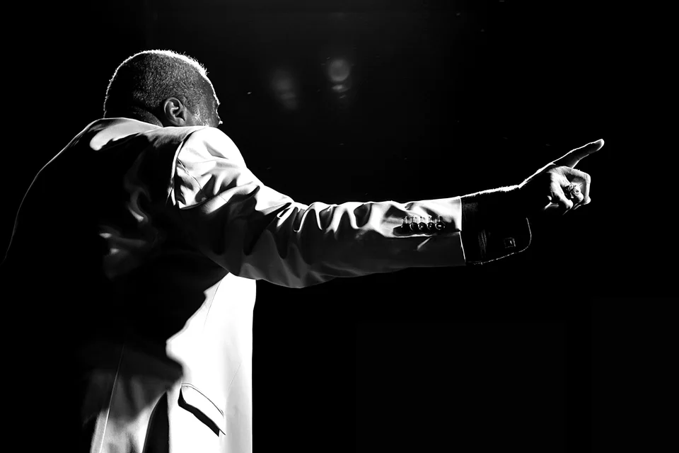 Keith on stage in black and white